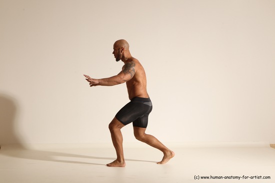 Underwear Gymnastic poses Man Black Muscular Bald Dancing Dynamic poses Academic