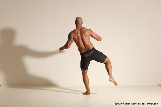 Underwear Gymnastic poses Man Black Muscular Bald Dancing Dynamic poses Academic