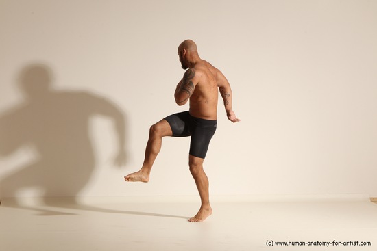 Underwear Gymnastic poses Man Black Muscular Bald Dancing Dynamic poses Academic