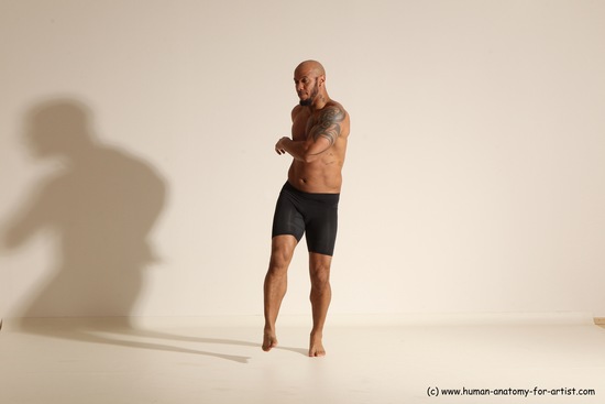 Underwear Gymnastic poses Man Black Muscular Bald Dancing Dynamic poses Academic