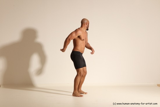 Underwear Gymnastic poses Man Black Muscular Bald Dancing Dynamic poses Academic