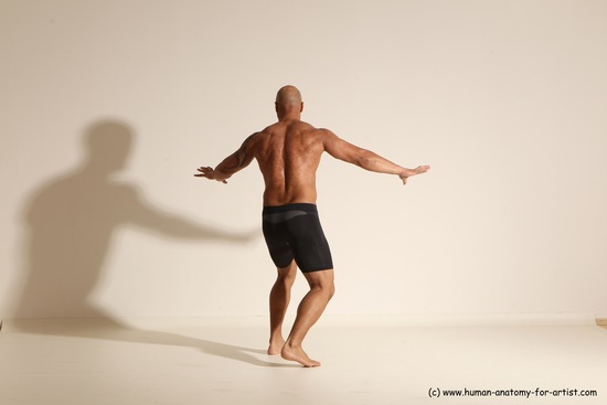 Underwear Gymnastic poses Man Black Muscular Bald Dancing Dynamic poses Academic