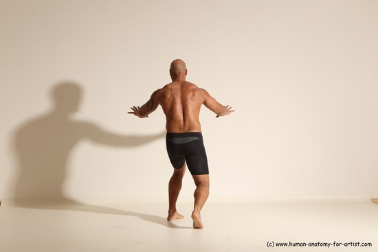 Underwear Gymnastic poses Man Black Muscular Bald Dancing Dynamic poses Academic