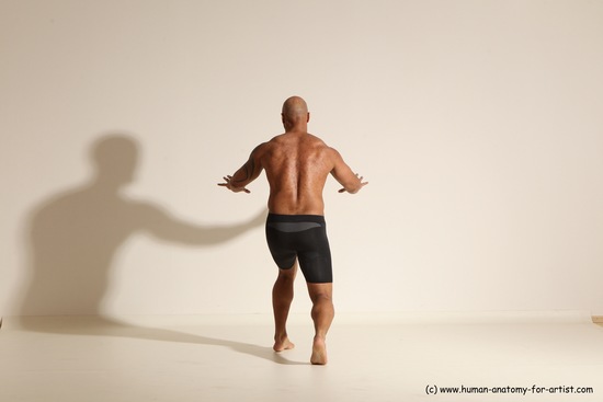 Underwear Gymnastic poses Man Black Muscular Bald Dancing Dynamic poses Academic