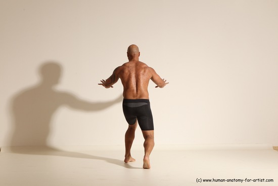 Underwear Gymnastic poses Man Black Muscular Bald Dancing Dynamic poses Academic