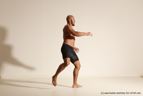 Underwear Gymnastic poses Man Black Muscular Bald Dancing Dynamic poses Academic