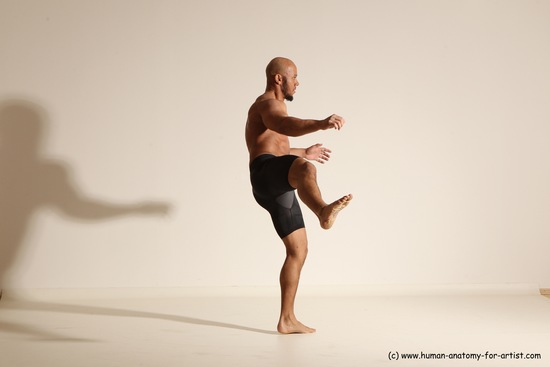 Underwear Gymnastic poses Man Black Muscular Bald Dancing Dynamic poses Academic