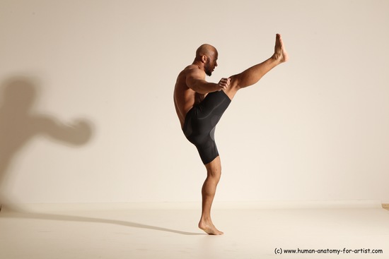 Underwear Gymnastic poses Man Black Muscular Bald Dancing Dynamic poses Academic