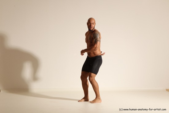 Underwear Gymnastic poses Man Black Muscular Bald Dancing Dynamic poses Academic