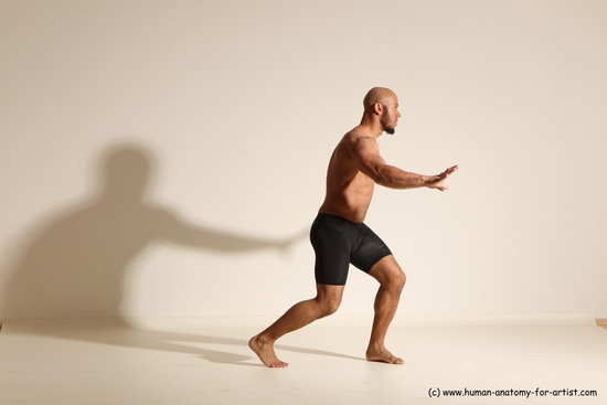 Underwear Gymnastic poses Man Black Muscular Bald Dancing Dynamic poses Academic