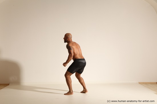 Underwear Gymnastic poses Man Black Muscular Bald Dancing Dynamic poses Academic