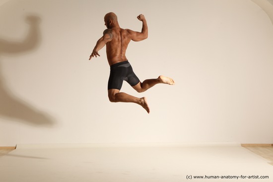 Underwear Gymnastic poses Man Black Muscular Bald Dancing Dynamic poses Academic