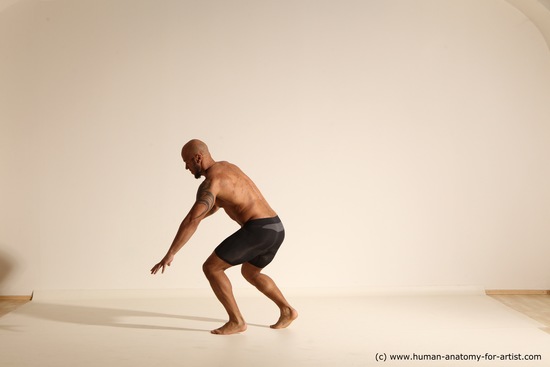 Underwear Gymnastic poses Man Black Muscular Bald Dancing Dynamic poses Academic