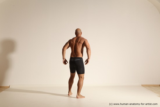 Underwear Gymnastic poses Man Black Muscular Bald Dancing Dynamic poses Academic