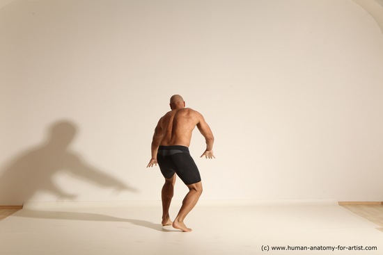 Underwear Gymnastic poses Man Black Muscular Bald Dancing Dynamic poses Academic