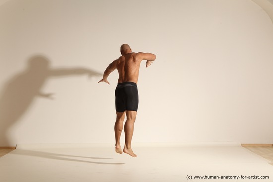 Underwear Gymnastic poses Man Black Muscular Bald Dancing Dynamic poses Academic