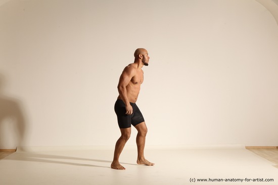 Underwear Gymnastic poses Man Black Muscular Bald Dancing Dynamic poses Academic