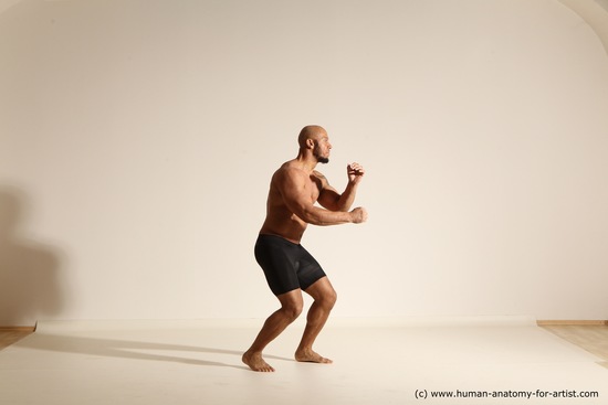 Underwear Gymnastic poses Man Black Muscular Bald Dancing Dynamic poses Academic