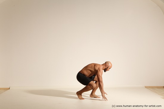 Underwear Gymnastic poses Man Black Muscular Bald Dancing Dynamic poses Academic