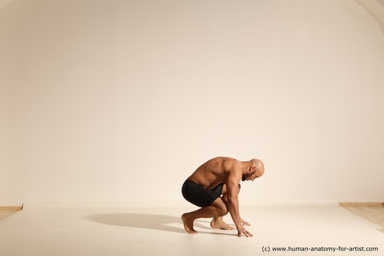 Underwear Gymnastic poses Man Black Muscular Bald Dancing Dynamic poses Academic