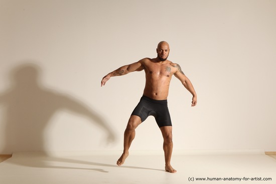 Underwear Gymnastic poses Man Black Muscular Bald Dancing Dynamic poses Academic