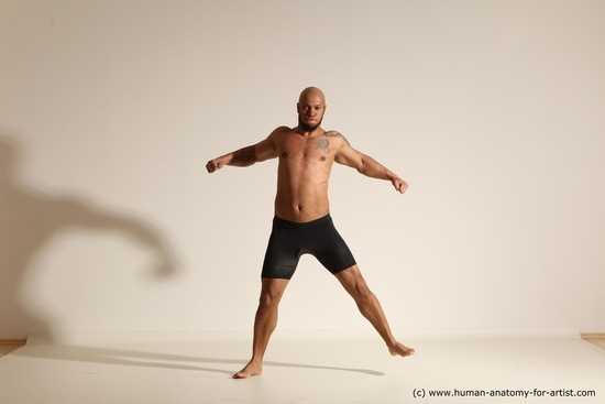 Underwear Gymnastic poses Man Black Muscular Bald Dancing Dynamic poses Academic