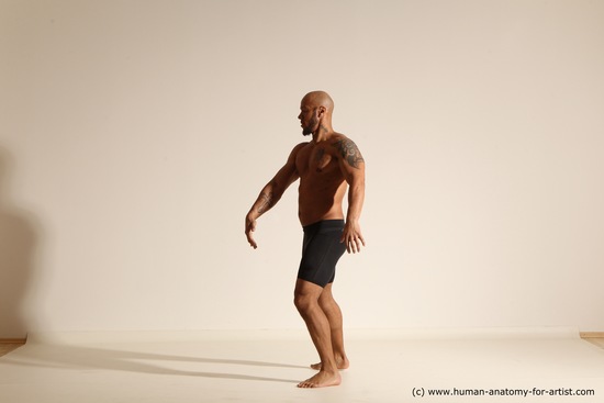 Underwear Gymnastic poses Man Black Muscular Bald Dancing Dynamic poses Academic