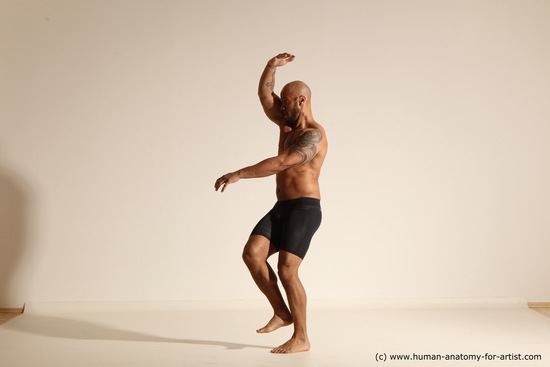 Underwear Gymnastic poses Man Black Muscular Bald Dancing Dynamic poses Academic