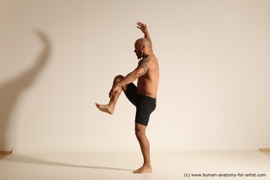 Underwear Gymnastic poses Man Black Muscular Bald Dancing Dynamic poses Academic