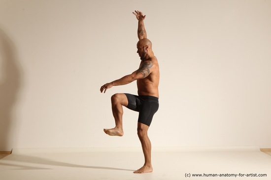 Underwear Gymnastic poses Man Black Muscular Bald Dancing Dynamic poses Academic