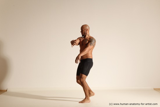 Underwear Gymnastic poses Man Black Muscular Bald Dancing Dynamic poses Academic