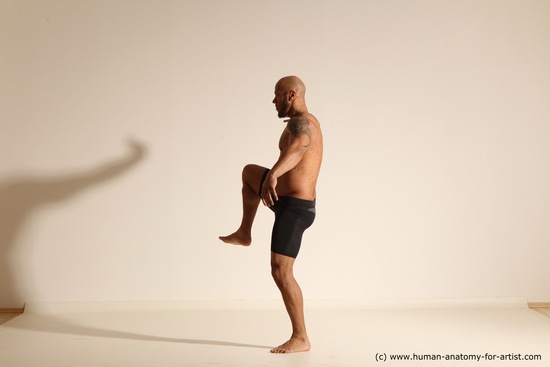 Underwear Gymnastic poses Man Black Muscular Bald Dancing Dynamic poses Academic