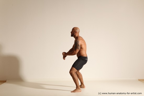 Underwear Gymnastic poses Man Black Muscular Bald Dancing Dynamic poses Academic