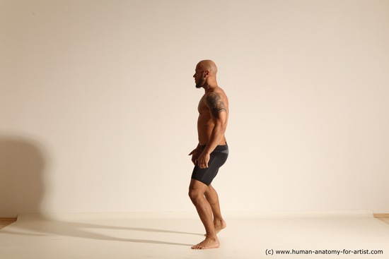 Underwear Gymnastic poses Man Black Muscular Bald Dancing Dynamic poses Academic