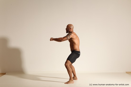 Underwear Gymnastic poses Man Black Muscular Bald Dancing Dynamic poses Academic