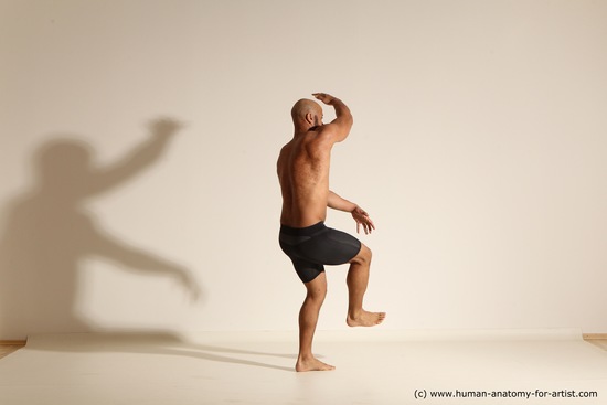 Underwear Gymnastic poses Man Black Muscular Bald Dancing Dynamic poses Academic