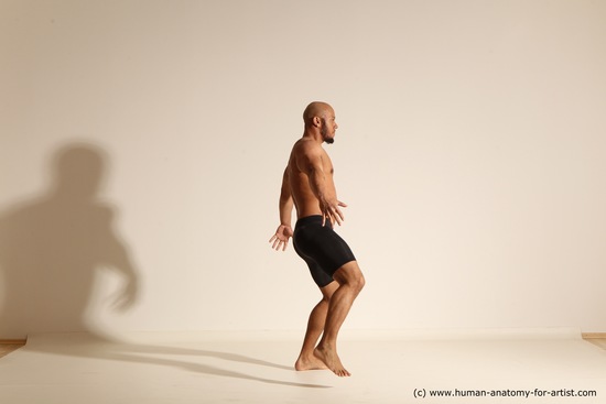 Underwear Gymnastic poses Man Black Muscular Bald Dancing Dynamic poses Academic