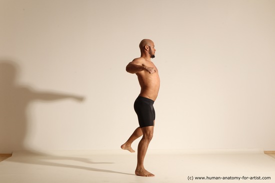 Underwear Gymnastic poses Man Black Muscular Bald Dancing Dynamic poses Academic