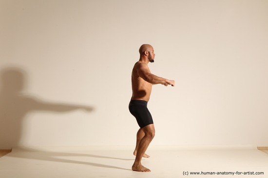 Underwear Gymnastic poses Man Black Muscular Bald Dancing Dynamic poses Academic