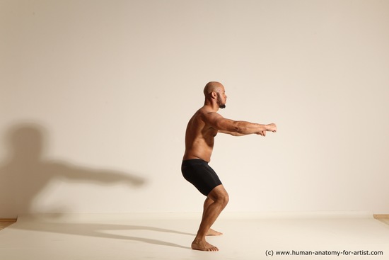 Underwear Gymnastic poses Man Black Muscular Bald Dancing Dynamic poses Academic