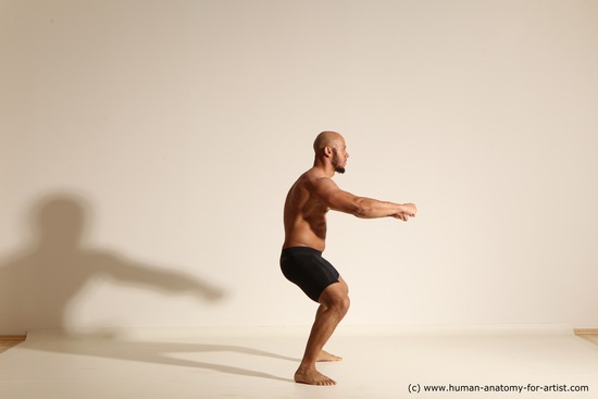 Underwear Gymnastic poses Man Black Muscular Bald Dancing Dynamic poses Academic