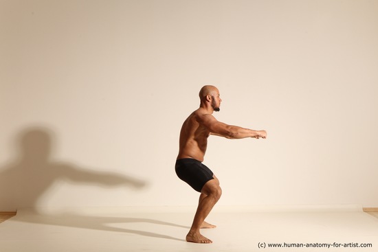 Underwear Gymnastic poses Man Black Muscular Bald Dancing Dynamic poses Academic