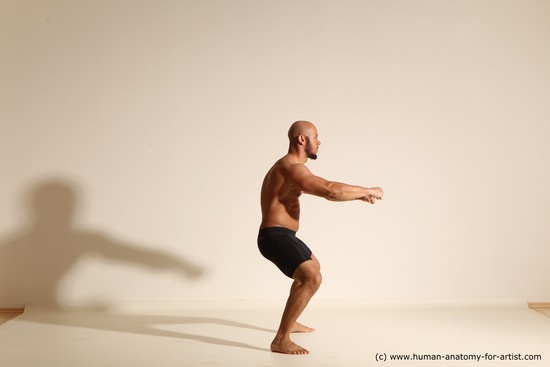 Underwear Gymnastic poses Man Black Muscular Bald Dancing Dynamic poses Academic