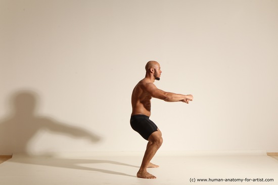 Underwear Gymnastic poses Man Black Muscular Bald Dancing Dynamic poses Academic