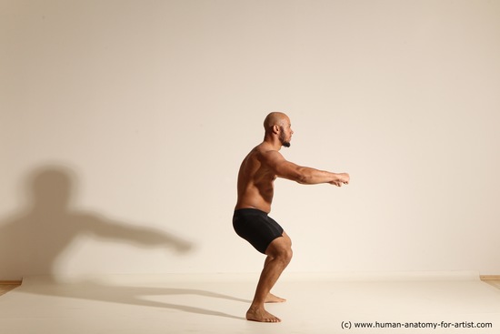 Underwear Gymnastic poses Man Black Muscular Bald Dancing Dynamic poses Academic