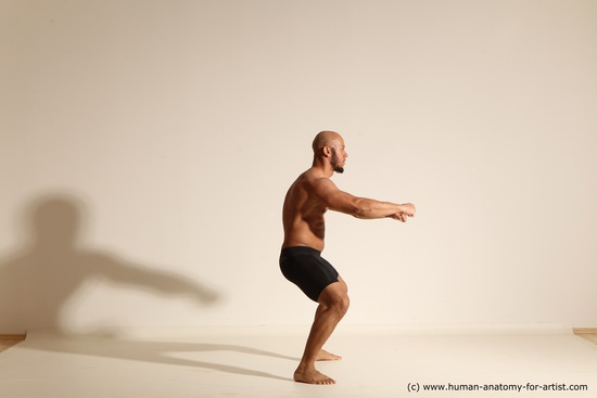 Underwear Gymnastic poses Man Black Muscular Bald Dancing Dynamic poses Academic