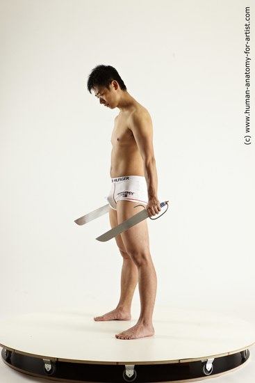 Underwear Fighting with knife Man Asian Average Medium Black Multi angles poses Academic