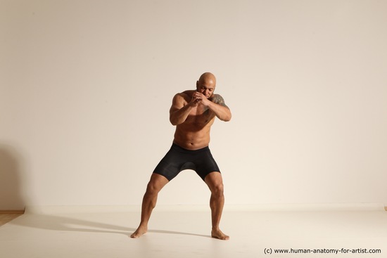 Underwear Gymnastic poses Man Black Muscular Bald Dancing Dynamic poses Academic