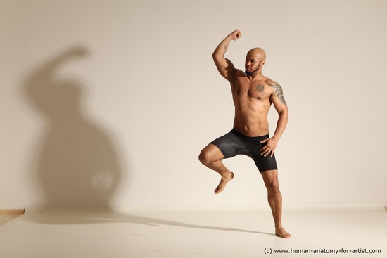 Underwear Gymnastic poses Man Black Muscular Bald Dancing Dynamic poses Academic