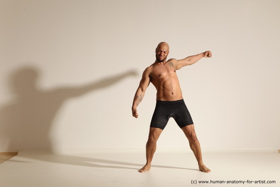 Underwear Gymnastic poses Man Black Muscular Bald Dancing Dynamic poses Academic